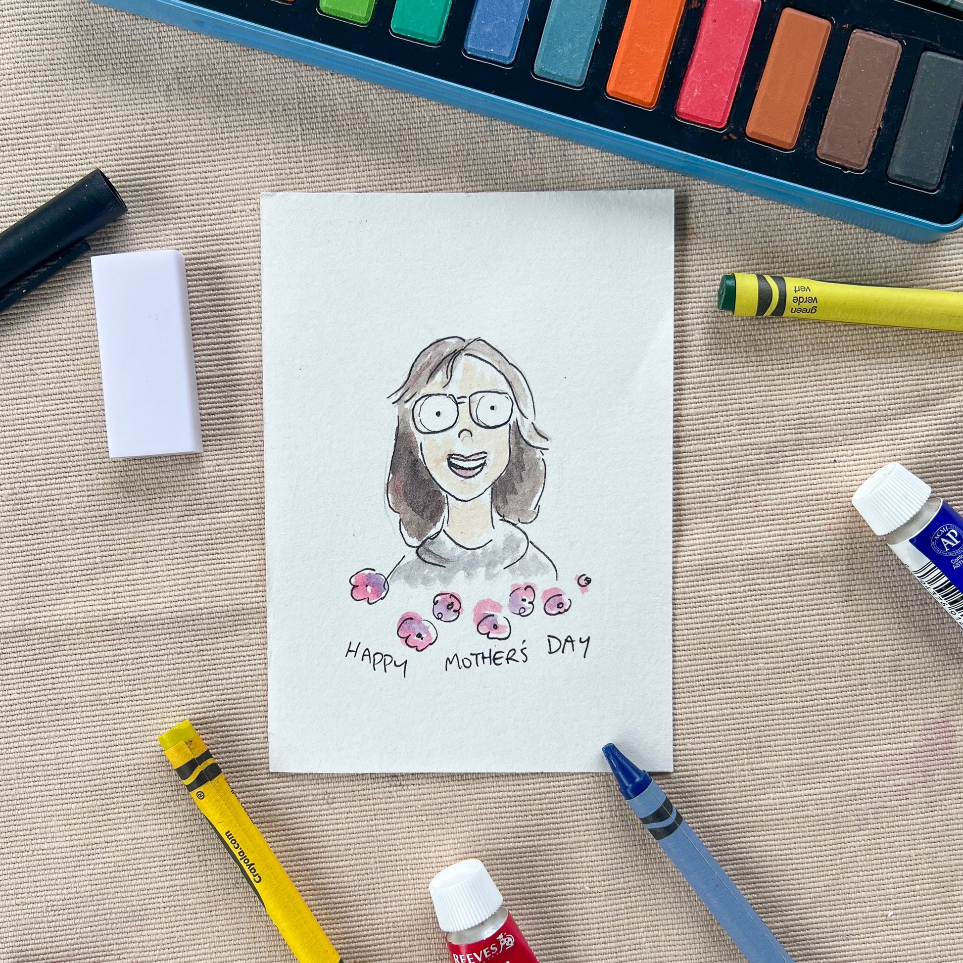 An illustration of my mum with silly googly eyes. Flowers and "happy mothers' day" is written below.